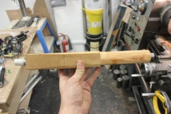 I glued the steel tube into the wood using expanding polyurethane glue, or gorilla glue.